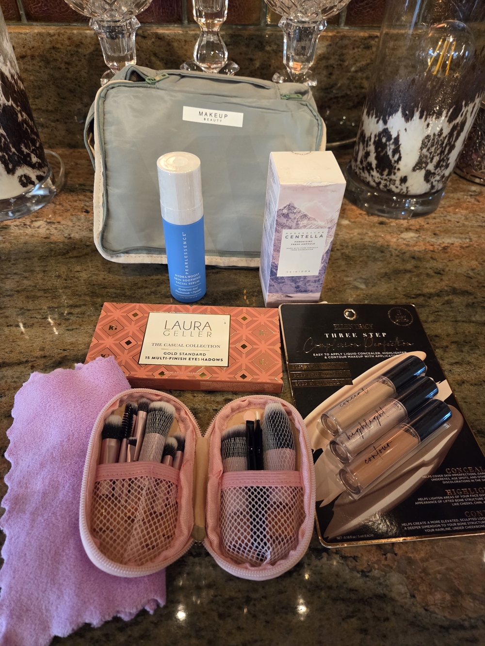 Bag Of Beauty Products With Light Green Makeup Bag with Pink Brush Set